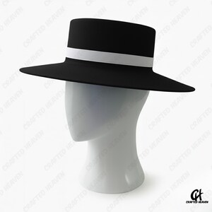 Elegant black felt top hat with wide brim and white satin band, inspired by Melania Trump’s inauguration style, displayed on white background