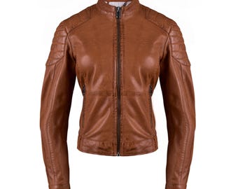 May include: A brown leather jacket with a stand-up collar and a full-length zipper. The jacket has quilted shoulder detailing and two zippered pockets. The sleeves are long and fitted. The jacket is a classic style.