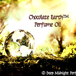 May include: A glass globe sits on a mossy surface in a forest setting. The globe is surrounded by green foliage and sunlight. The text "Chocolate Earth™ Perfume Oil" is displayed above the globe. The text "© Deep Midnight Perfumes" is displayed below the globe.