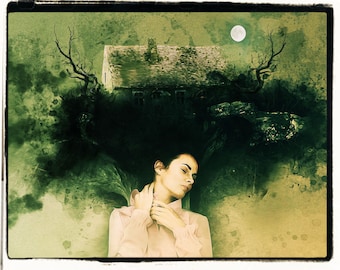 May include: A woman with long dark hair is sleeping with her head resting on a house with a full moon in the background. The house is surrounded by trees and the image has a watercolor effect.