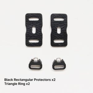 May include: Two black rectangular protectors and two triangle rings are displayed against a white background. The protectors have a textured surface and three rectangular cutouts. The triangle rings have a D-shaped ring attached to a rectangular base.