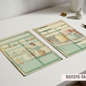 May include: Two vintage-style recipe cards with a retro illustration of a woman in a kitchen. The cards have a green and beige color scheme with space for writing. The words "Recipe Cards" are in a pink rectangle.