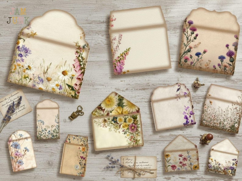May include: A collection of vintage-style paper envelopes and cards, adorned with floral illustrations. The envelopes feature various shapes and sizes, with designs including daisies, foxgloves, and wildflowers. The color palette includes cream, beige, and pastel hues.