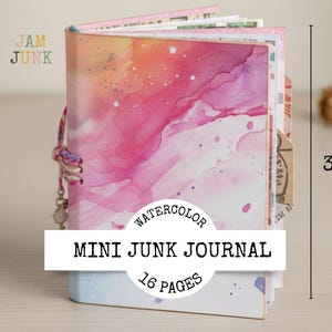May include: A watercolor mini junk journal, 3.5 inches tall, with a pink, orange, and white abstract design. The journal has 16 pages and is tied with a decorative cord. The cover features the text "Watercolor Mini Junk Journal".
