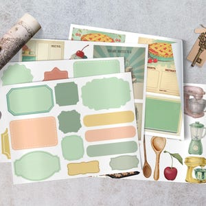 May include: A collection of vintage-style kitchen-themed ephemera, including labels, recipe cards, and illustrations of kitchen tools. The color palette features soft greens, peaches, and yellows, with a scroll and key adding to the antique aesthetic.