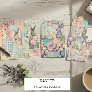 May include: Three Easter-themed paper pockets with bunny illustrations and pastel colors. The pockets are decorated with gingham patterns, eggs, and floral accents. The image also includes scissors, lavender, and a cup of coffee.