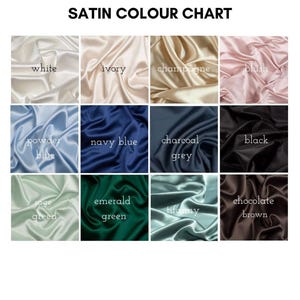 May include: A satin color chart featuring twelve fabric swatches in a grid layout. The text SATIN COLOUR CHART appears at the top. Colors include white, ivory, champagne, blush, powder blue, navy blue, charcoal grey, black, sage green, emerald green, tiffany, and chocolate brown.
