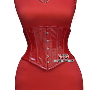 May include: A glossy red corset with a structured design. The corset features a series of silver-colored clasps down the front and is designed to cinch the waist. The text "HI-DARK WEARS" is visible on the lower right.