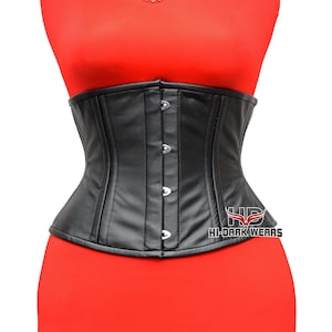 May include: A black leather corset with a structured design. The corset has a series of silver-colored clasps down the front and is displayed on a red mannequin. The logo "HI-DARK WEARS" is visible on the lower right.