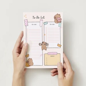 May include: A pink and white to-do list with a cartoon animal illustration. The list has two columns labeled "To-Do" and a section labeled "Goals".