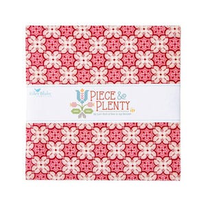 May include: A red and white fabric with a geometric pattern. The fabric is labeled "Piece & Plenty" by Lori Holt of Bee in My Bonnet.