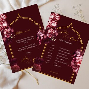 May include: Two burgundy wedding invitation cards with gold accents and floral arrangements. The cards feature text in gold script and a schedule. The text includes "Thank you for your presence" and "Nikah Programme".