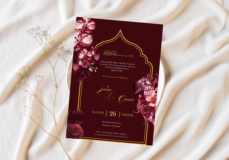 May include: Burgundy wedding invitation with gold accents and floral illustrations. The invitation features the names "Saia & Omar", date, time, and location. The design includes a decorative arch and floral arrangements.
