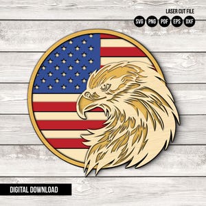 May include: A laser-cut wooden design depicting the American flag and an eagle's head. The flag shows red and white stripes with a blue star field. The eagle is in tan and gold tones. The design is circular, with the text "DIGITAL DOWNLOAD".