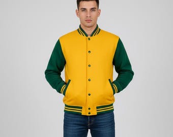 May include: A yellow varsity jacket with green sleeves and trim. The jacket has a button-up front and two front pockets. The person is wearing blue jeans.