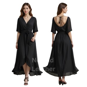May include: A black wrap dress with a V-neckline and short sleeves. The dress features a tie waist and a high-low hemline. The back of the dress has a low scoop design. The dress is made of a flowing fabric.