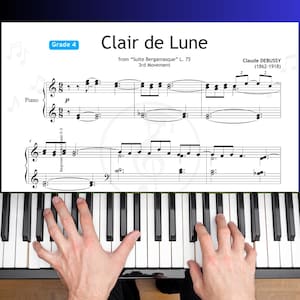 Partitura para piano simplificada Clair de Lune, grau 4, de Debussy, edição prática com cores, notas de letras e números de dedos