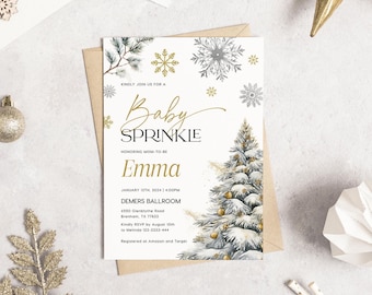 May include: A baby sprinkle invitation with a winter theme. The invitation features a watercolor illustration of a snowy Christmas tree, snowflakes, and the text "Baby Sprinkle" in gold script. The invitation is on a white background with a kraft paper envelope.