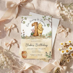 Watercolor illustration of a classic Winnie the Pooh and Piglet standing by a large wooden number one, featuring a honey pot, bees, and thistles on a soft yellow wash background.