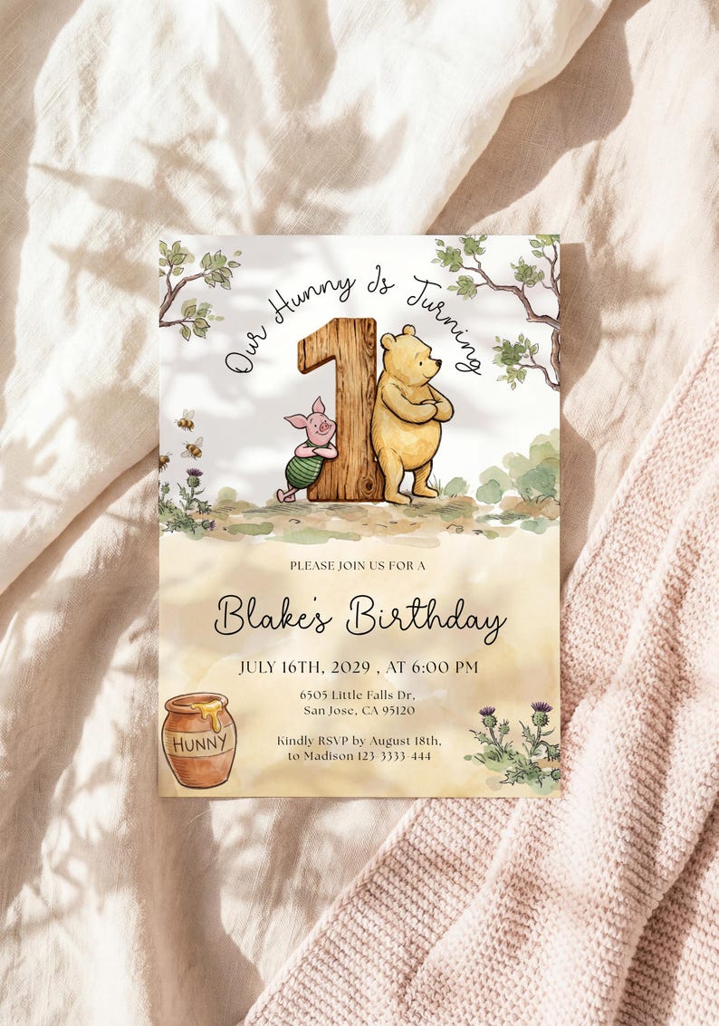Watercolor illustration of a classic Winnie the Pooh and Piglet standing by a large wooden number one, featuring a honey pot, bees, and thistles on a soft yellow wash background.