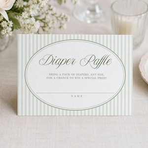 May include: A rectangular diaper raffle card featuring a sage green and white vertical striped pattern. The centre contains an oval frame with the text Diaper Raffle, Bring a pack of diapers, any size, for a chance to win a special prize!, and Name.