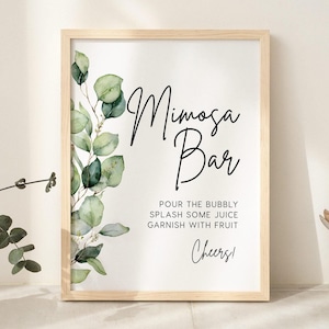 May include: A printable sign with a watercolor eucalyptus illustration and the text "Mimosa Bar" with instructions to "Pour the bubbly, splash some juice, garnish with fruit. Cheers!"
