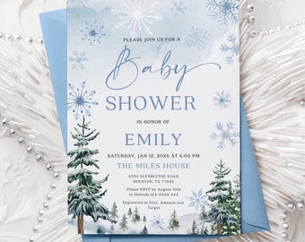 May include: A rectangular baby shower invitation card featuring a watercolor winter theme with blue snowflakes and green pine trees. The text reads: PLEASE JOIN US FOR A Baby SHOWER IN HONOR OF EMILY SATURDAY, JAN 12, 2026 AT 6:00 PM THE MILES HOUSE.