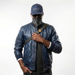 May include: A person wearing a navy blue baseball cap with "DEDSEC" text, sunglasses, and a patterned face covering. They are wearing a blue leather bomber jacket with a black strap across their body.