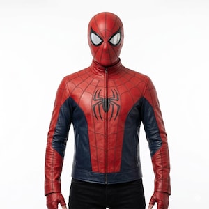 May include: A red and navy blue Spider-Man jacket and mask. The jacket has a black spider emblem and web pattern. The mask has white eye lenses. The jacket is made of leather-like material.