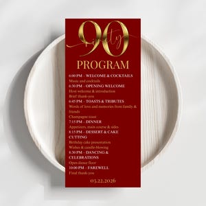 May include: A red 90th birthday program card with gold lettering, detailing the event's schedule. The card lists timings for welcome drinks, dinner, cake cutting, dancing, and farewell. The date 03.22.2026 is displayed at the bottom of the card.