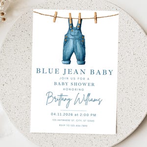May include: Baby shower invitation with watercolor blue jean overalls hanging from a clothesline. The text reads "BLUE JEAN BABY" and invites guests to a baby shower honoring Brittany Williams on April 11, 2026.