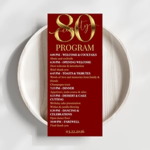 Puede incluir: Una tarjeta de programa de cumpleaños número 80 en rojo y dorado. La tarjeta presenta la palabra "PROGRAMA" y un programa detallado de eventos, que incluyen cena, brindis y baile. La fecha "03.22.2026" está impresa en la parte inferior.