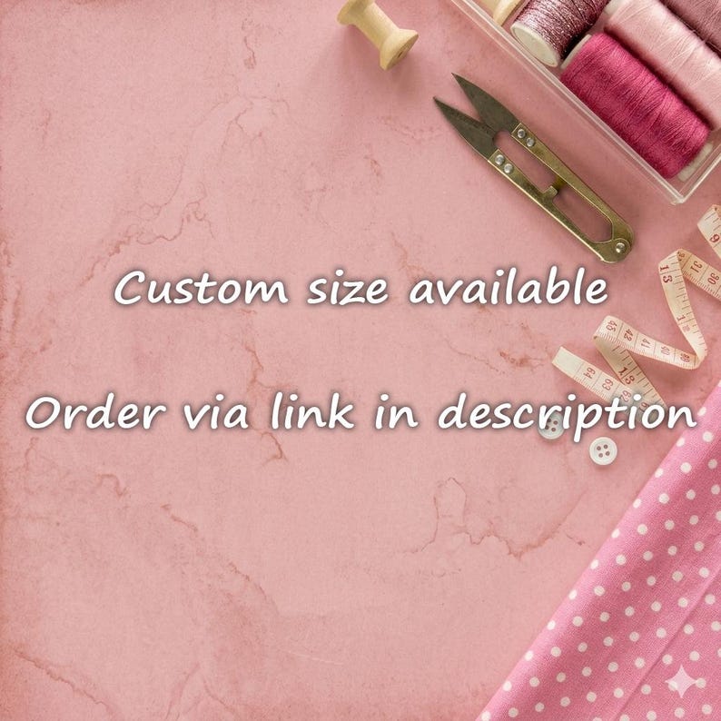 May include: Sewing supplies including metal scissors, a wooden spool, a white measuring tape, and pink polka dot fabric. The text reads: Custom size available. Order via link in description. These items are arranged on a pink marble surface.