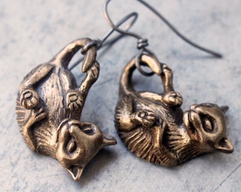 Playing cat earrings, dangling titanium earrings