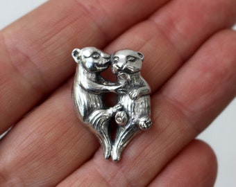 Otters holding hands, otter love necklace