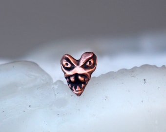 Tiny heart monster titanium nose stud