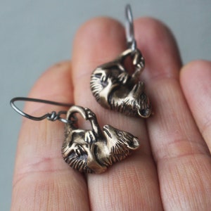 Baby opossum titanium earrings
