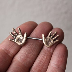 Nipple piercing jewelry. Human anatomy, hands. image 1