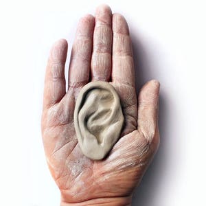 Human ear earring display photo prop image 1