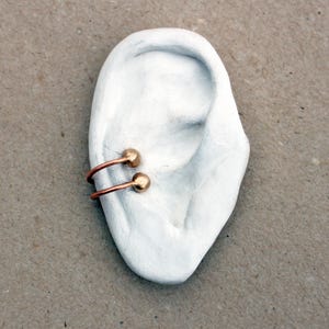 Human ear earring display photo prop image 2