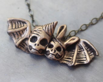 Party people being fly in the afterlife, Winged skull necklace