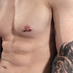 Nipple piercing jewelry. Human anatomy, hands. image 4