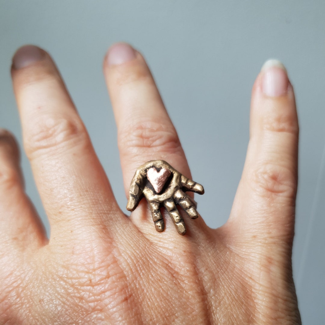 Heart in Hand Ring Etsy