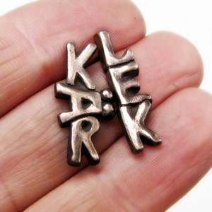 Swedish jewelry bronze and titanium earrings love kärlek image 1