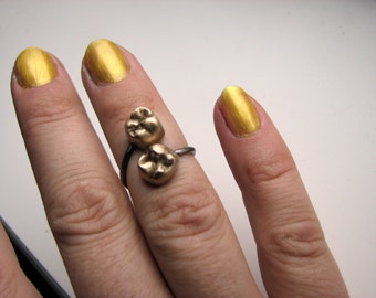 Human tooth knuckle ring.