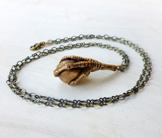 Bird Claw Grasping a Bead Pendant 