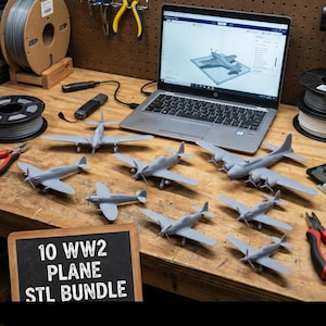 May include: A collection of gray WW2 model airplanes arranged on a wooden surface, with a laptop displaying a 3D model of a plane in the background. A chalkboard sign reads "10 WW2 PLANE STL BUNDLE".