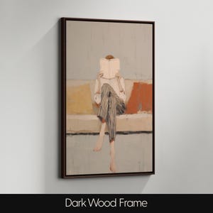 May include: An abstract painting in a dark wood frame shows a person reading a book on a sofa. The person wears a white shirt and striped trousers. The sofa has yellow and orange cushions. The text "Dark Wood Frame" is at the bottom of the image.