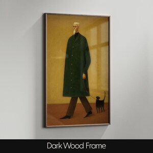 May include: A framed art print depicts a figure in a long green coat walking a black cat on a leash. The figure wears glasses and a white beard. The artwork is set against a yellow background and framed in dark wood.