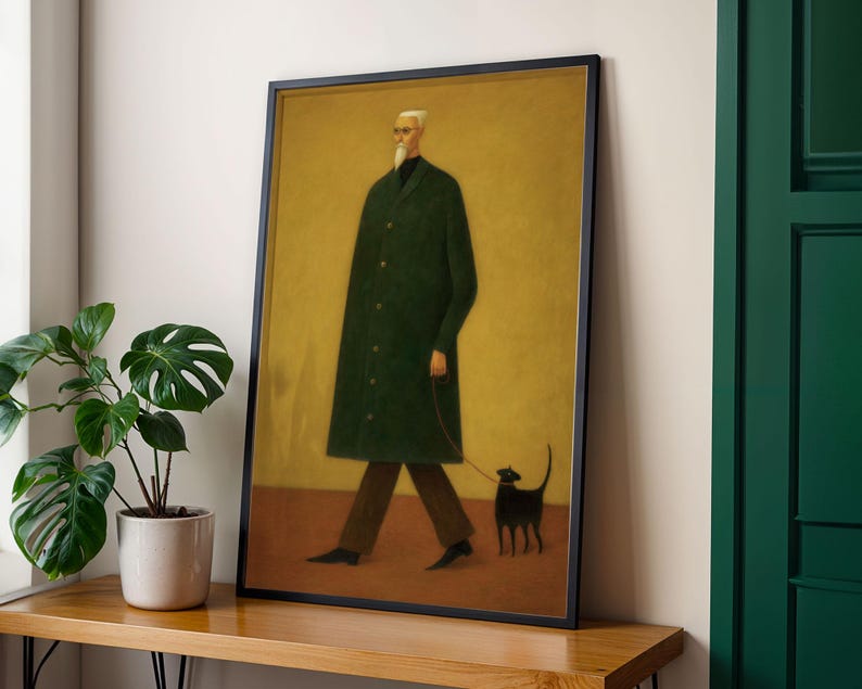 May include: Framed art print featuring a man in a long green coat walking a black cat on a leash. The artwork has a minimalist style with a yellow background and a black frame. The man has white hair and a beard.